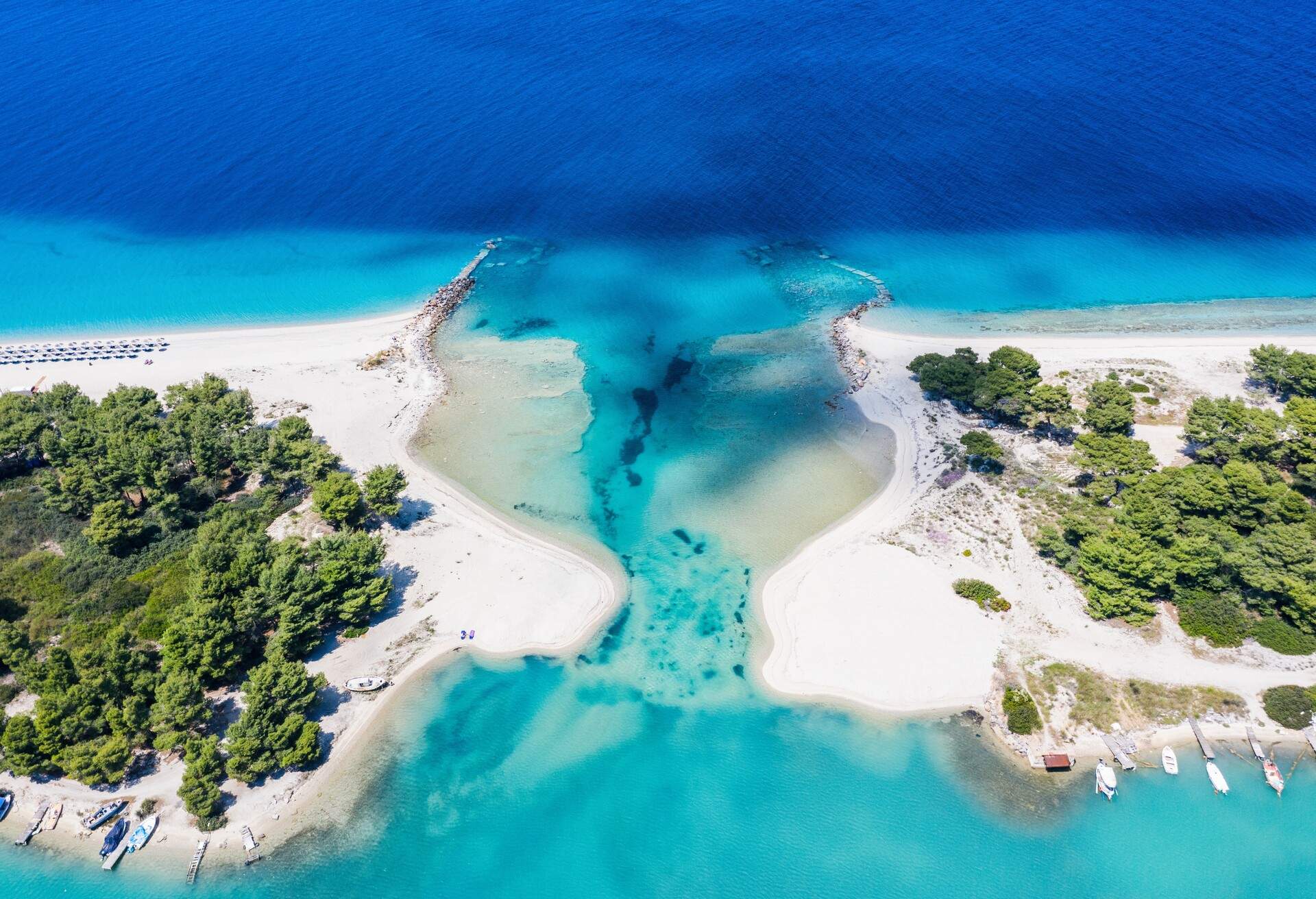 Aerial drone view of Port Glarokavos and lagoon beach in Kassandra penisula Chalkidiki Greece