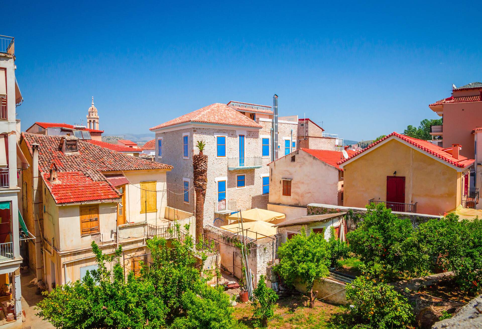 Traditional cozy greek street in city Nafplio, Greece; Shutterstock ID 1273747819